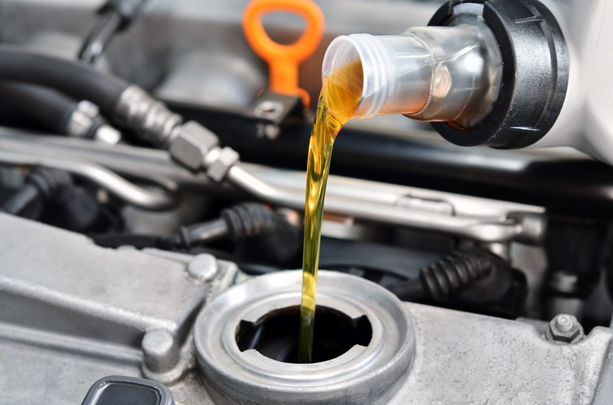 oil being poured into car