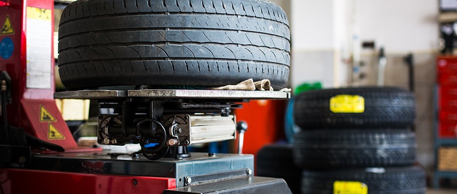 Tire being balanced in auto shop