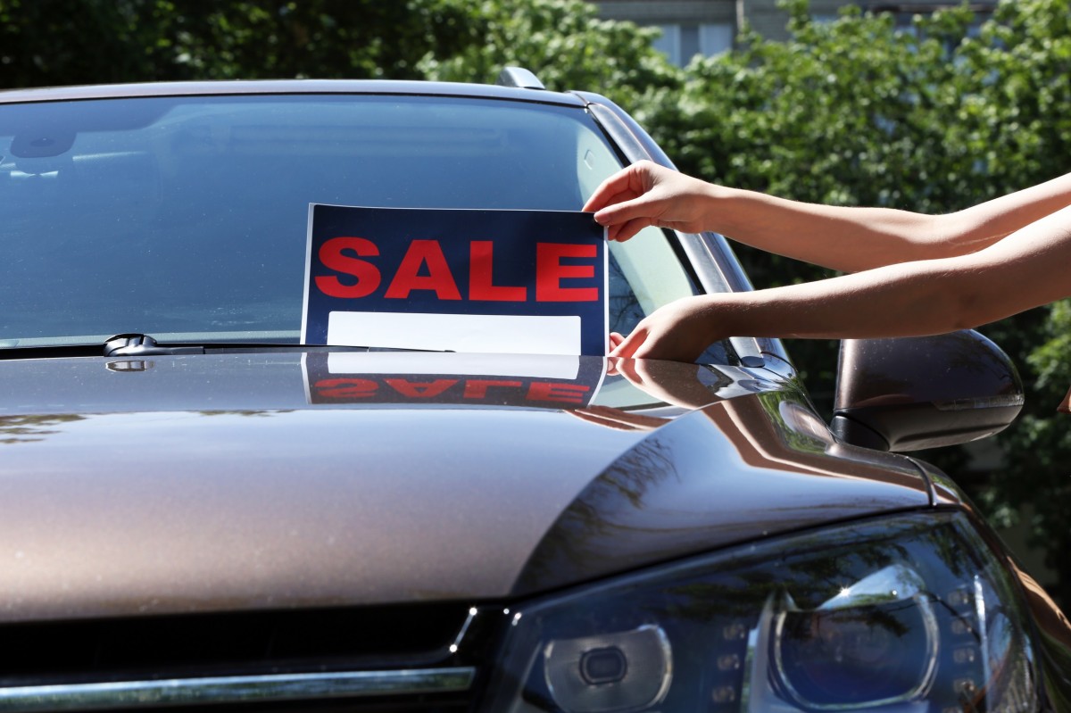 car with for sale sign on the window 