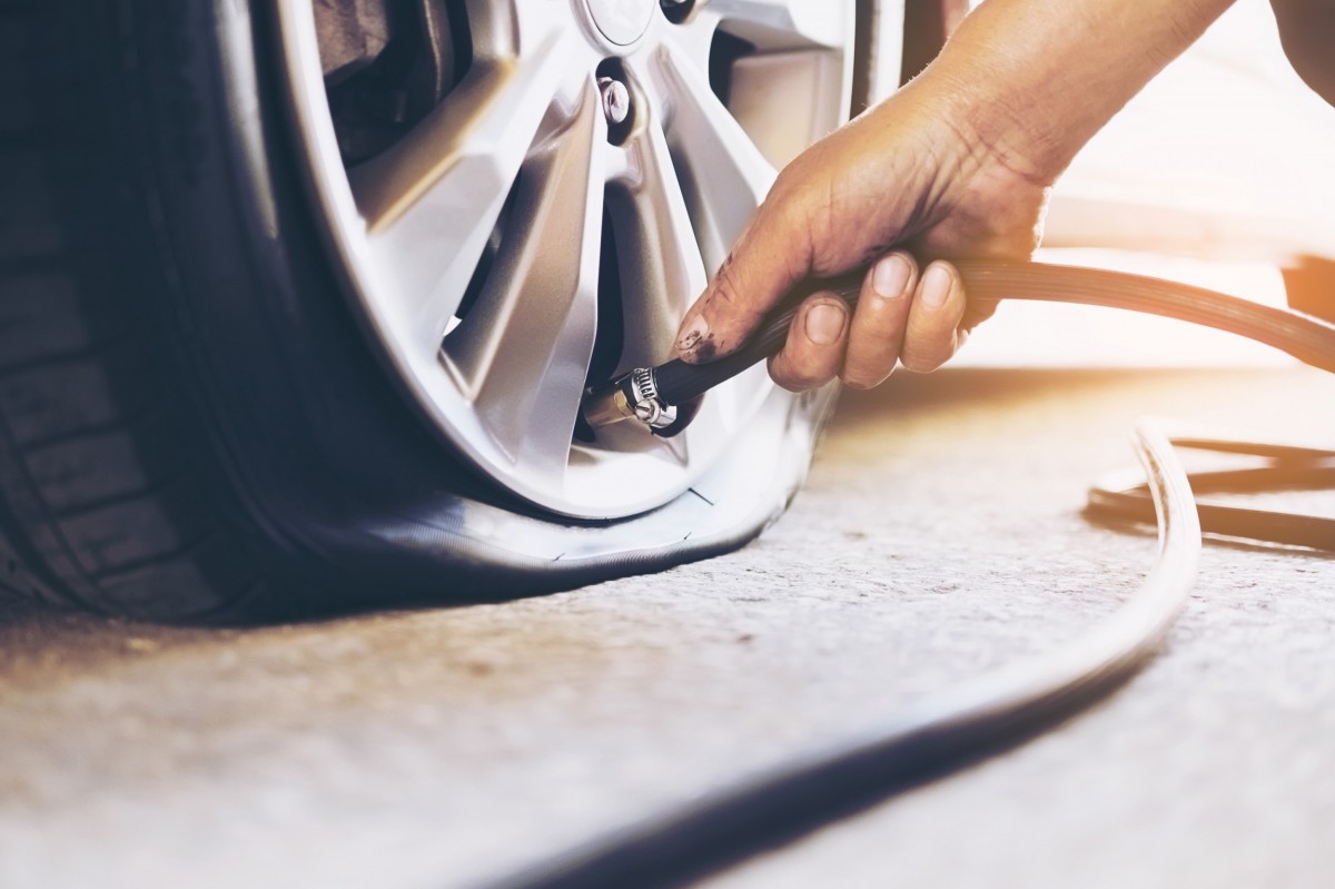 flat tire with air being put in