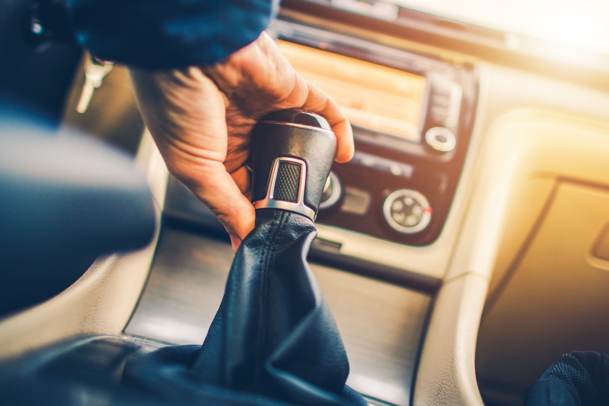 gear shift with hand on it